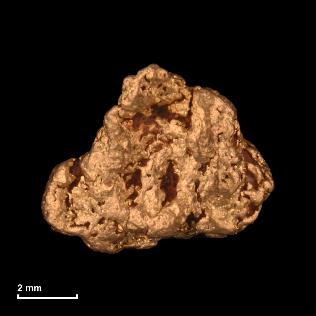 Goldnugget Nr. 26-0132 mit Maßstab: 7,7 × 6,3 mm bei 0,78 g